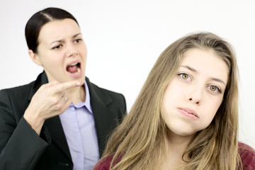 Mother shouting to unhappy daughter