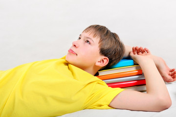 Obraz premium Tired Teenager with a Books