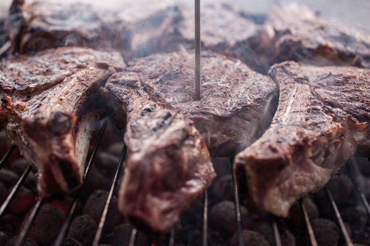 big beef steaks on bone grill