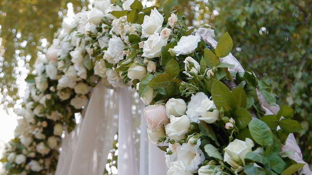 Wedding arch with natural roses