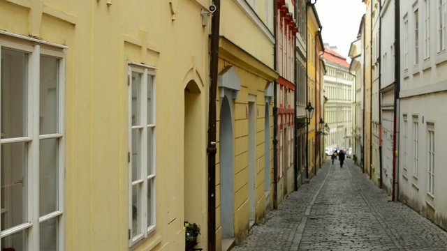 narrow street in city - prague - retro buildings
