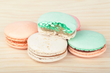 Traditional French sweets Macarons on wooden background