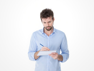 young man focused on his notes