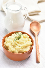 Mashed potato and jug of milk