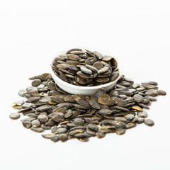 pumpkin seeds isolated on white background. Fresh roasted Pumpki