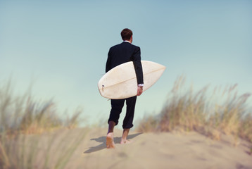 Businessman with Surfboard Going to the Beach
