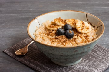 Oatmeal served with berries and bananas