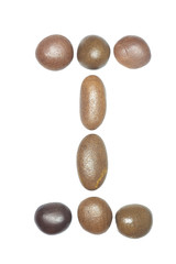 collection of letters of sea stones close-up isolated on white b