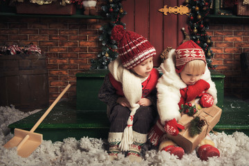 Children playing in a Christmas garden - 78718093