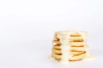 isolated stack of several pancake with condensed milk
