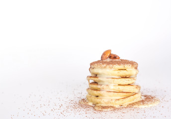 isolated stack of pancake with cocoa and nuts