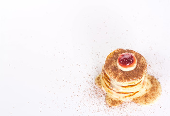 isolated stack of several pancake with banana and jam