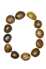 collection of letters of sea stones close-up isolated on white b