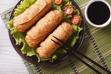 spring rolls fried on lettuce closeup, horizontal top view