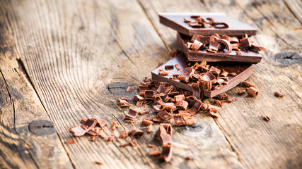Pieces of chocolate bow wooden board.