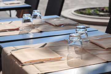 Empty glasses on the table of street cafe