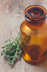 pharmacy bottle and thyme herb