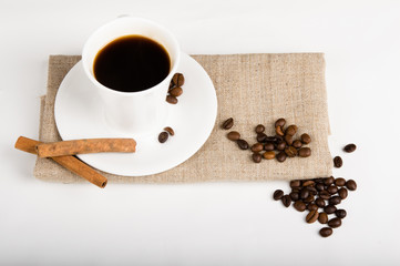 Coffee cup and beans on a white background.