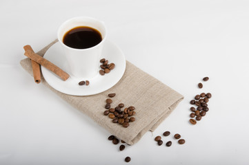 Coffee cup and beans on a white background.