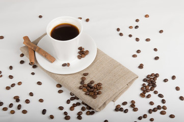 Coffee cup and beans on a white background.