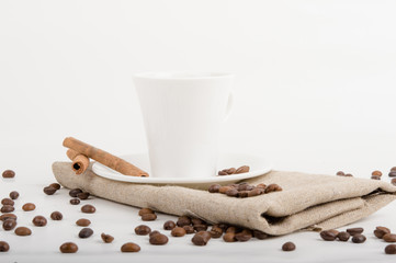 Coffee cup and beans on a white background.