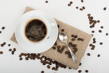 Coffee cup and beans on a white background.