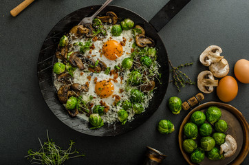 Vegetable omelet with bulls eye egg and sprouts