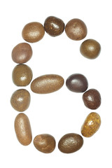 collection of letters of sea stones close-up isolated