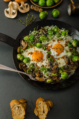 Vegetable omelet with bulls eye egg and sprouts
