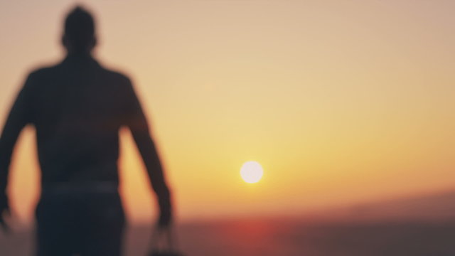 Silhouette of man on the sunset