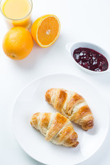 delicious breakfast with croissants and juice