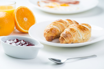 delicious breakfast with croissants and juice