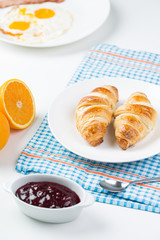 delicious breakfast with croissants and juice