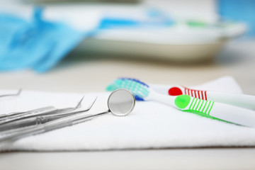 Set dentist tools on napkin on table close up