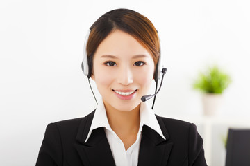 young beautiful businesswoman with headset in office