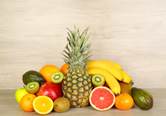 Assortment of exotic fruits on wooden background