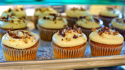 Cupcakes with nuts  on the bakery storefront