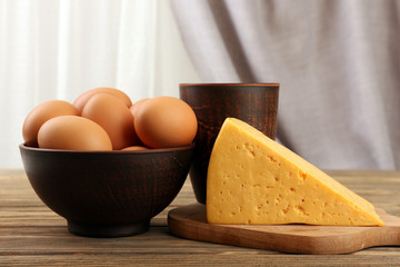 Tasty dairy products on table on fabric background