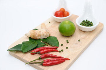 Many seasoning on wooden chopping block.