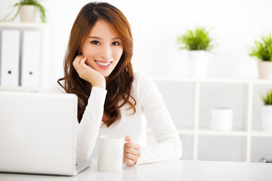 smiling Young asian woman  with laptop
