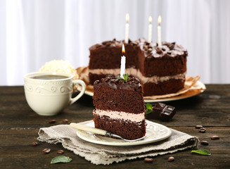 Delicious chocolate cake on table on light background