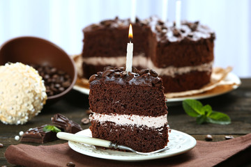 Delicious chocolate cake on table on light background