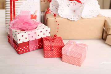 Beautiful gift boxes on wooden background. Valentine Day