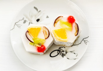 Delicious cake with fruits on a plate
