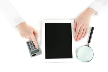 Hands working in the office with laptop and calculator,