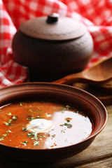 Ukrainian beetroot soup - borscht in bowl and pot,