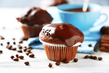 Tasty homemade chocolate muffins and cup of coffee