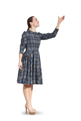 woman looking up and raising her hand