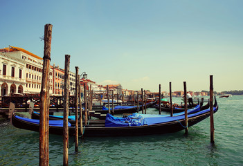 Fototapeta na wymiar Gondolas moored. Venice, Italy, Europe
