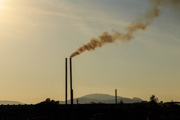 Smokestacks at sunset time
